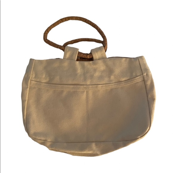 Small canvas bag/purse with accent bow on front. - Picture 2 of 3